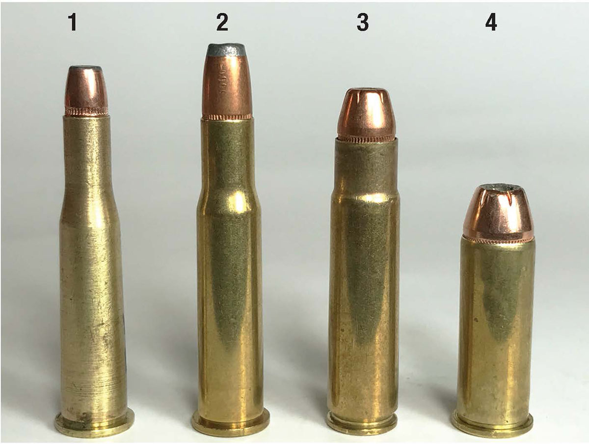 These four rounds represent common lever-action cartridges: (1) .25-35 Winchester, (2) .30-30 Winchester, (3) .35 Remington, (4) .44 Remington Magnum.